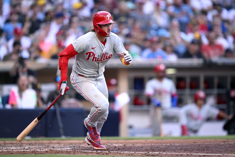 Sep 4, 2023; San Diego, California, USA; Philadelphia Phillies second baseman Bryson Stott (5) hits a double against the San Diego Padres during the sixth inning at Petco Park. Mandatory Credit: Orlando Ramirez-USA TODAY Sports