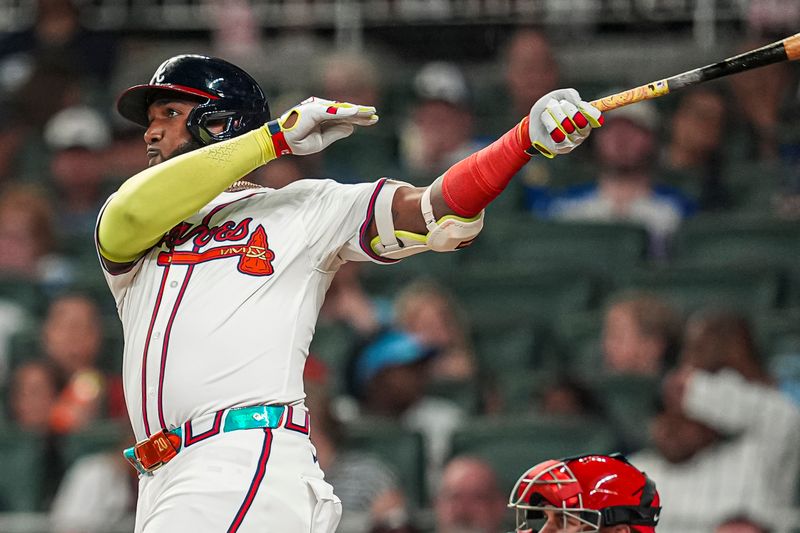 Aug 20, 2024; Cumberland, Georgia, USA; Atlanta Braves designated hitter Marcell Ozuna (20) hits a home run against the Philadelphia Phillies during the sixth inning at Truist Park. Mandatory Credit: Dale Zanine-USA TODAY Sports