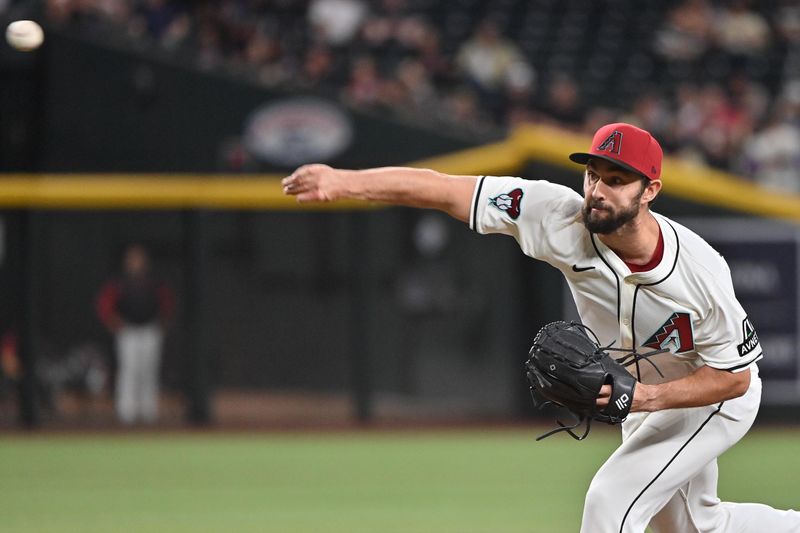 Apr 24, 2025; Phoenix, Arizona, USA;  Arizona Diamondbacks pitcher J.P. Feyereisen (61) throws in the tenth inning against the Tampa Bay Rays at Chase Field. Mandatory Credit: Matt Kartozian-Imagn Images