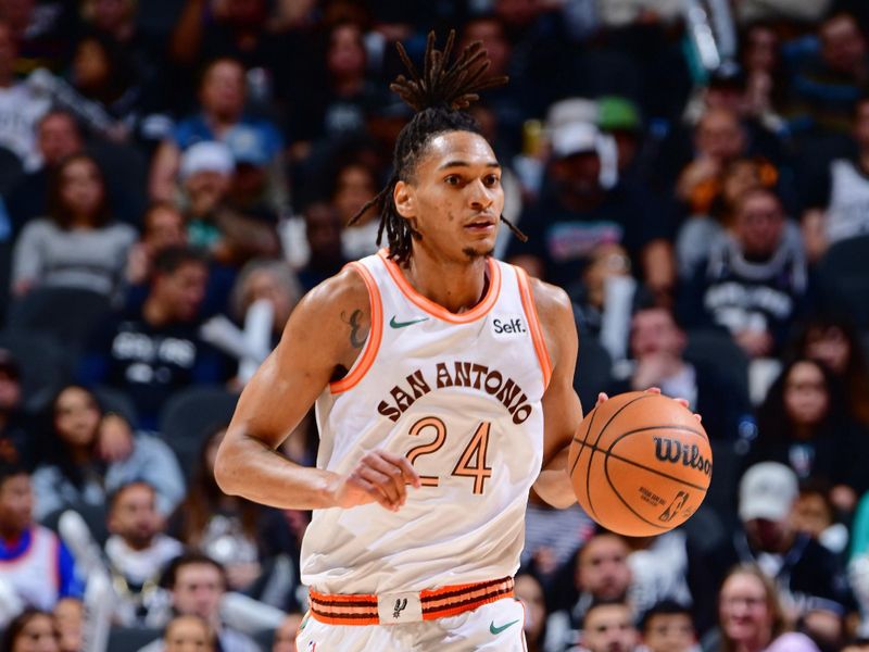 SAN ANTONIO, TX - FEBRUARY 3: Devin Vassell #24 of the San Antonio Spurs brings the ball up court during the game against the Cleveland Cavaliers on February 3, 2024 at the Frost Bank Center in San Antonio, Texas. NOTE TO USER: User expressly acknowledges and agrees that, by downloading and or using this photograph, user is consenting to the terms and conditions of the Getty Images License Agreement. Mandatory Copyright Notice: Copyright 2024 NBAE (Photos by Barry Gossage/NBAE via Getty Images)