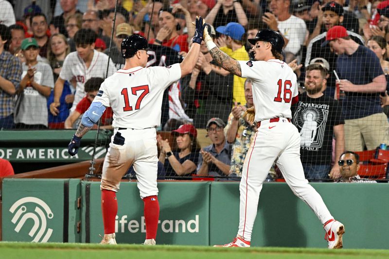 Jun 12, 2024; Boston, Massachusetts, USA; Boston Red Sox outfielder Jarren Duran (16) high-fives outfielder Tyler O'Neill (17)  during the fifth inning at Fenway Park. Duran scored on a RBI hit by O'Neill. Mandatory Credit: Brian Fluharty-USA TODAY Sports