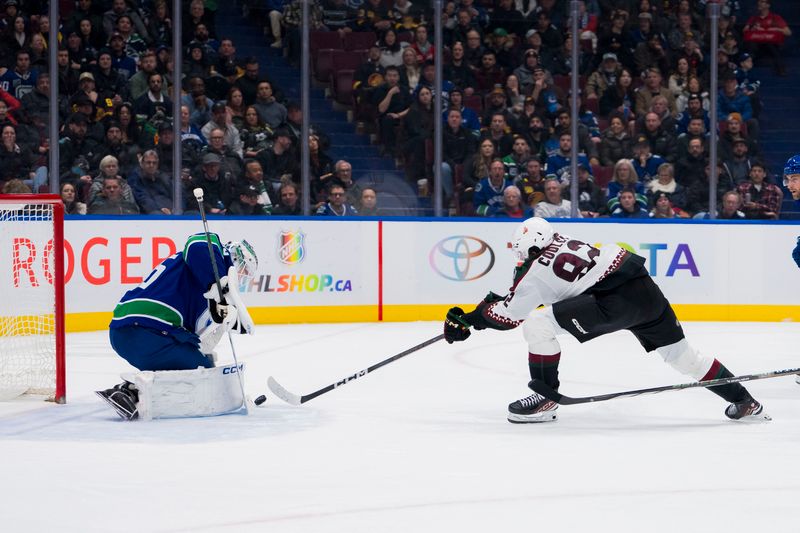 Jan 18, 2024; Vancouver, British Columbia, CAN; Vancouver Canucks goalie Thatcher Demko (35) makes a save Arizona Coyotes forward Logan Cooley (92) in the second period at Rogers Arena. Mandatory Credit: Bob Frid-USA TODAY Sports