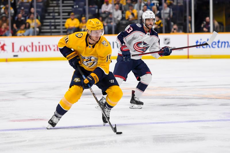 Apr 13, 2024; Nashville, Tennessee, USA; Nashville Predators center Gustav Nyquist (14) skates against the Columbus Blue Jackets during the first period at Bridgestone Arena. Mandatory Credit: Steve Roberts-USA TODAY Sports