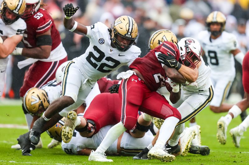 Nov 11, 2023; Columbia, South Carolina, USA; Vanderbilt Commodores linebacker Bryce Cowan (22) closes in on South Carolina Gamecocks running back Mario Anderson (24) in the second quarter at Williams-Brice Stadium. Mandatory Credit: Jeff Blake-USA TODAY Sports