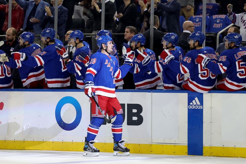 Oct 16, 2023; New York, New York, USA; New York Rangers left wing Chris Kreider (20) celebrates his goal against the Arizona Coyotes with teammates during the first period at Madison Square Garden. Mandatory Credit: Brad Penner-USA TODAY Sports