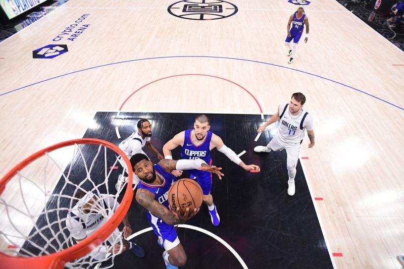 LOS ANGELES, CA - APRIL 21:  Paul George #13 of the LA Clippers drives to the basket during the game against the Dallas Mavericks during Round 1 Game 1 of the 2024 NBA Playoffs on April 21, 2024 at Crypto.Com Arena in Los Angeles, California. NOTE TO USER: User expressly acknowledges and agrees that, by downloading and/or using this Photograph, user is consenting to the terms and conditions of the Getty Images License Agreement. Mandatory Copyright Notice: Copyright 2024 NBAE (Photo by Adam Pantozzi/NBAE via Getty Images)