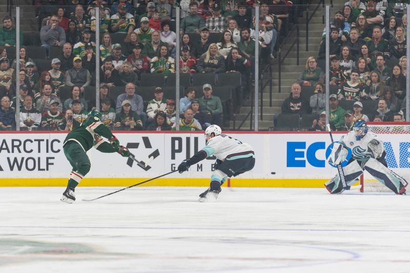 Apr 18, 2024; Saint Paul, Minnesota, USA; Minnesota Wild left wing Kirill Kaprizov (97) shoots and scores his 46th goal of the season on a power play in the first period against the Seattle Kraken at Xcel Energy Center. Mandatory Credit: Matt Blewett-USA TODAY Sports