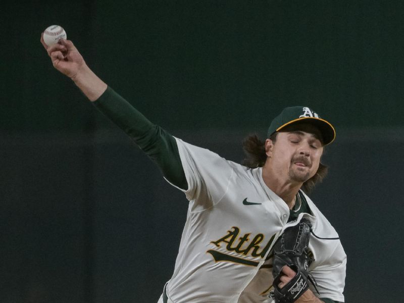 Apr 24, 2025; West Sacramento, California, USA; Athletics pitcher J.T. Ginn (70) throws a pitch against the Texas Rangers during the fourth inning at Sutter Health Park. Mandatory Credit: Ed Szczepanski-Imagn Images