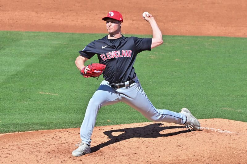 Feb 29, 2024; Tempe, Arizona, USA;  Cleveland Guardians relief pitcher Tim Herrin (29) throws in the third inning against the Los Angeles Angels during a spring training game at Tempe Diablo Stadium. Mandatory Credit: Matt Kartozian-USA TODAY Sports