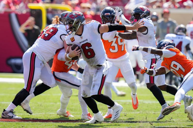 Tampa Bay Buccaneers quarterback Baker Mayfield (6) scrambles for the pocket during the second half of an NFL football game against the Denver Broncos, in Tampa, Fla. on Sunday, Sept. 22, 2024. (AP Photo/Chris O'Meara)