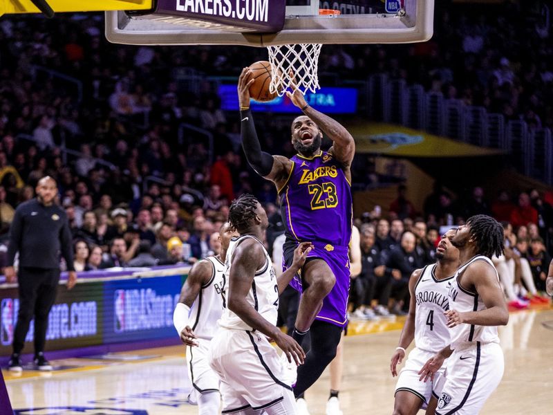 LOS ANGELES, CA - JANUARY 19:  LeBron James #23 of the Los Angeles Lakers goes to the basket during the game on January 19, 2024 at Crypto.Com Arena in Los Angeles, California. NOTE TO USER: User expressly acknowledges and agrees that, by downloading and/or using this Photograph, user is consenting to the terms and conditions of the Getty Images License Agreement. Mandatory Copyright Notice: Copyright 2024 NBAE (Photo by Tyler Ross/NBAE via Getty Images)