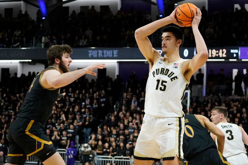 Dec 1, 2023; Evanston, Illinois, USA; Northwestern Wildcats center Matthew Nicholson (34) defends Purdue Boilermakers center Zach Edey (15) during the first half at Welsh-Ryan Arena. Mandatory Credit: David Banks-USA TODAY Sports