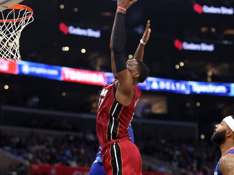 LOS ANGELES, CALIFORNIA - JANUARY 02: Bam Adebayo #13 of the Miami Heat dunks the ball against Reggie Jackson #1 of the Los Angeles Clippers during the fourth quarter at Crypto.com Arena on January 02, 2023 in Los Angeles, California. NOTE TO USER: User expressly acknowledges and agrees that, by downloading and or using this photograph, User is consenting to the terms and conditions of the Getty Images License Agreement. (Photo by Katelyn Mulcahy/Getty Images)