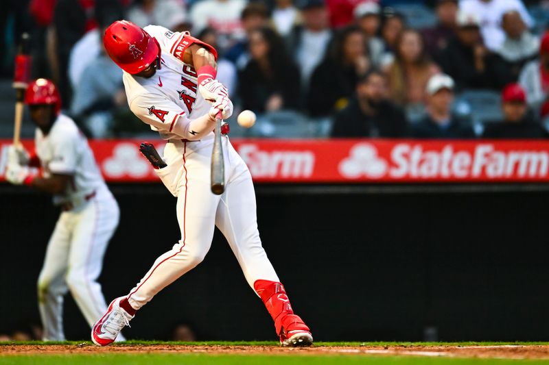 May 3, 2025; Anaheim, California, USA; Los Angeles Angels outfielder Kyren Paris (19) doubles against the Detroit Tigers during the second inning at Angel Stadium. Mandatory Credit: Jonathan Hui-Imagn Images