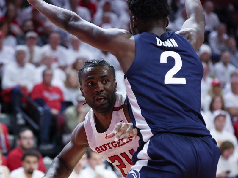 Jan 31, 2024; Piscataway, New Jersey, USA; Rutgers Scarlet Knights guard Austin Williams (24) dribbles against Penn State Nittany Lions guard D'Marco Dunn (2) during the second half at Jersey Mike's Arena. Mandatory Credit: Vincent Carchietta-USA TODAY Sports