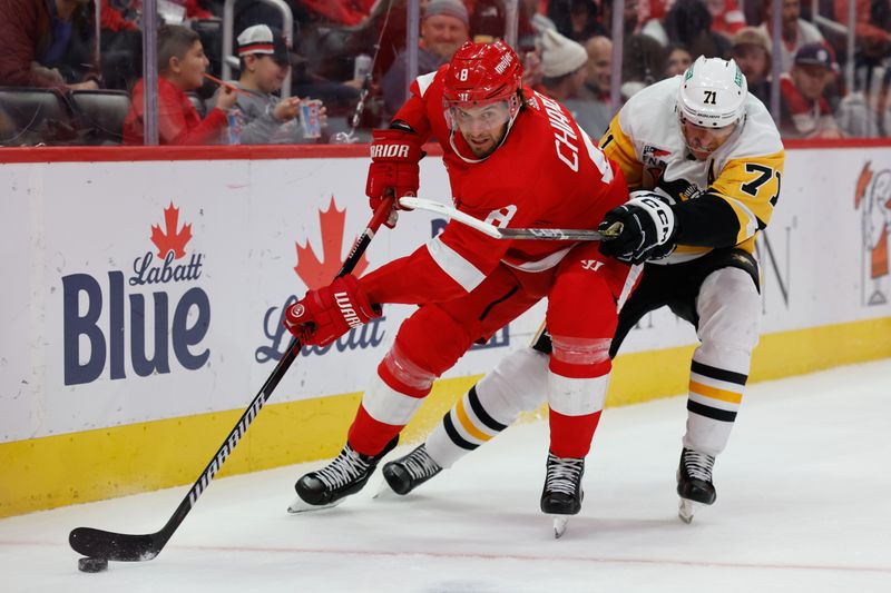 Oct 18, 2023; Detroit, Michigan, USA; Detroit Red Wings defenseman Ben Chiarot (8) skates with the puck chased by Pittsburgh Penguins center Evgeni Malkin (71) in the third period at Little Caesars Arena. Mandatory Credit: Rick Osentoski-USA TODAY Sports