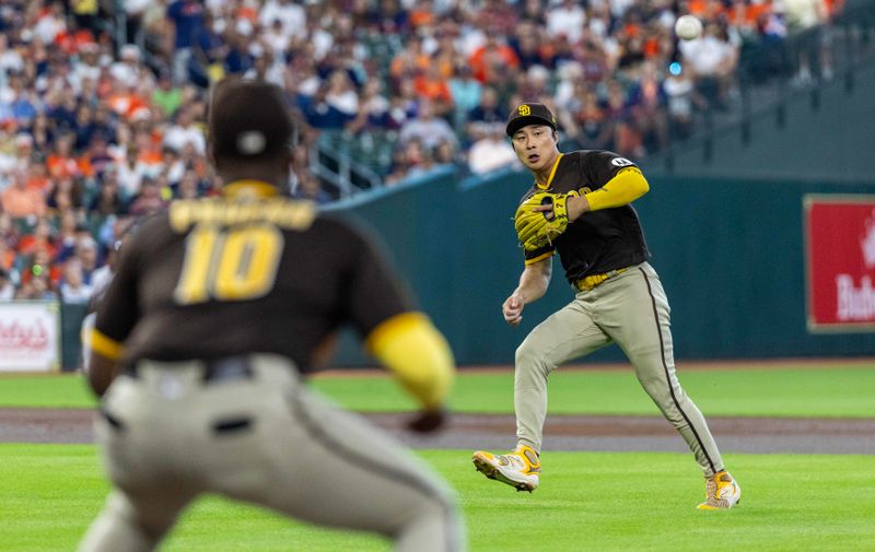 Sep 9, 2023; Houston, Texas, USA; San Diego Padres second baseman Ha-Seong Kim (7) throws out Houston Astros shortstop Jeremy Pena (3) (not pictured0  in the first inning at Minute Maid Park. Mandatory Credit: Thomas Shea-USA TODAY Sports