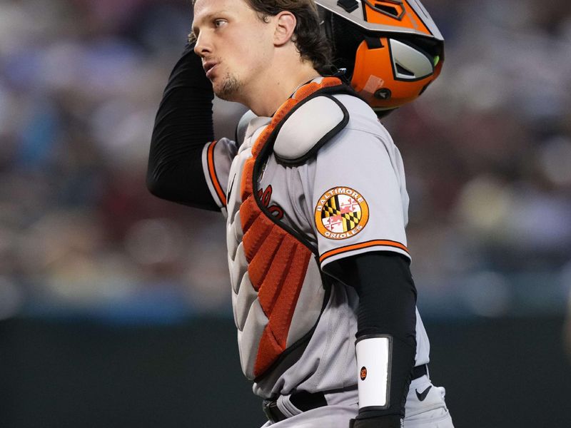 Sep 3, 2023; Phoenix, Arizona, USA; Baltimore Orioles catcher Adley Rutschman (35) looks on against the Arizona Diamondbacks at Chase Field. Mandatory Credit: Joe Camporeale-USA TODAY Sports