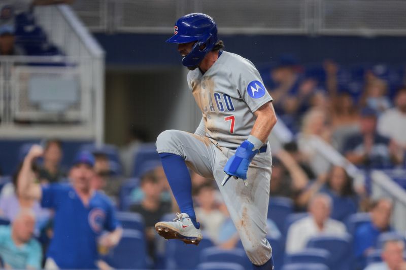 May 20, 2025; Miami, Florida, USA; Chicago Cubs shortstop Dansby Swanson (7) celebrates after scoring against the Miami Marlins during the sixth inning at loanDepot Park. Mandatory Credit: Sam Navarro-Imagn Images