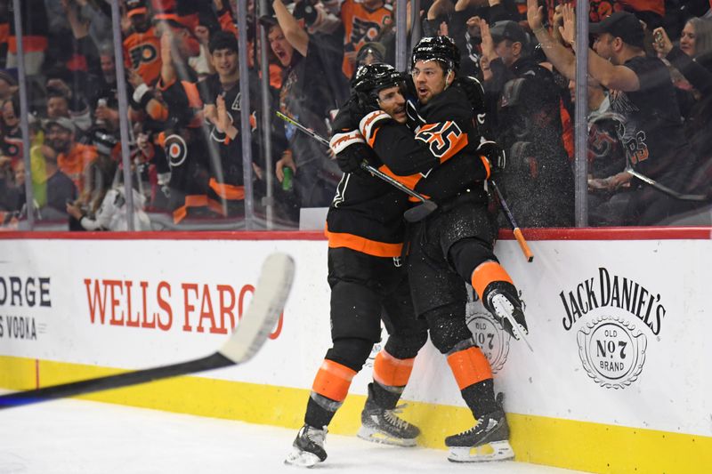 Oct 31, 2024; Philadelphia, Pennsylvania, USA; Philadelphia Flyers right wing Garnet Hathaway (19) celebrates his goal with center Ryan Poehling (25) during the first period at Wells Fargo Center. Mandatory Credit: Eric Hartline-Imagn Images