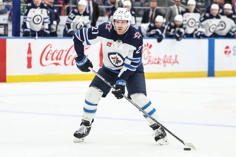Mar 4, 2025; Elmont, New York, USA;  Winnipeg Jets left wing Nikolaj Ehlers (27) controls the puck in the third period against the New York Islanders at UBS Arena. Mandatory Credit: Wendell Cruz-Imagn Images