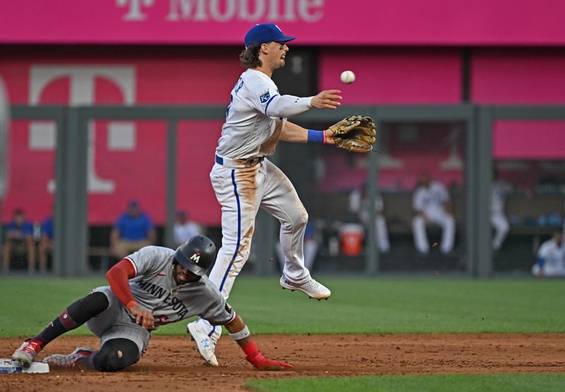 Jul 29, 2023; Kansas City, Missouri, USA;  Kansas City Royals shortstop Bobby Witt Jr. (7) completes a double play against Minnesota Twins center fielder Willi Castro (50)during the sixth inning at Kauffman Stadium. Mandatory Credit: Peter Aiken-USA TODAY Sports