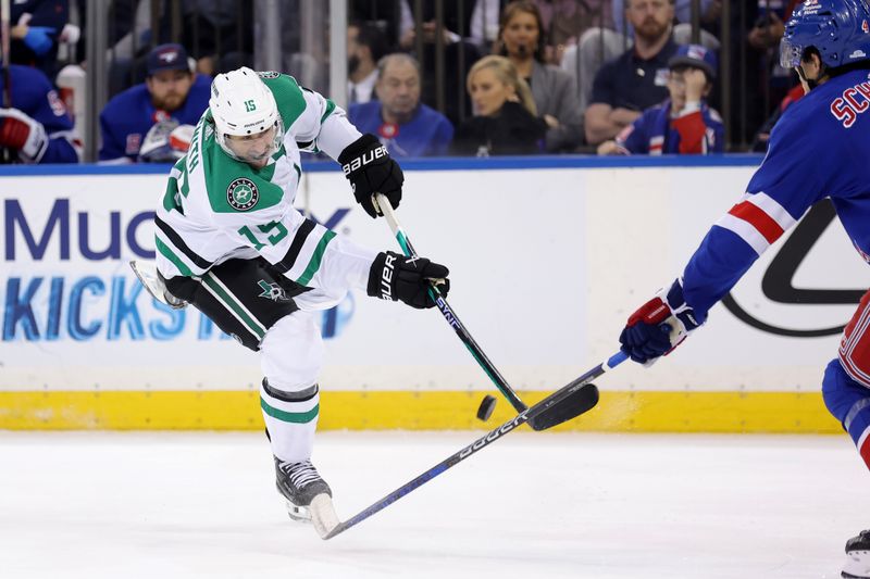 Feb 20, 2024; New York, New York, USA; Dallas Stars center Craig Smith (15) takes a shot against New York Rangers defenseman Braden Schneider (4) during the third period at Madison Square Garden. Mandatory Credit: Brad Penner-USA TODAY Sports