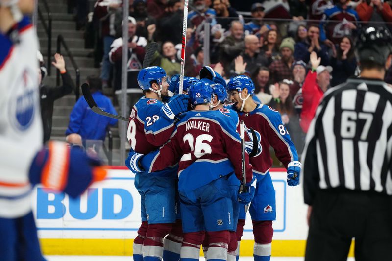 Apr 18, 2024; Denver, Colorado, USA; Colorado Avalanche left wing Zach Parise (9) (center) and left wing Miles Wood (28) and defenseman Sean Walker (26) and defenseman Caleb Jones (82) celebrate a goal in the second period against the Edmonton Oilers at Ball Arena. Mandatory Credit: Ron Chenoy-USA TODAY Sports