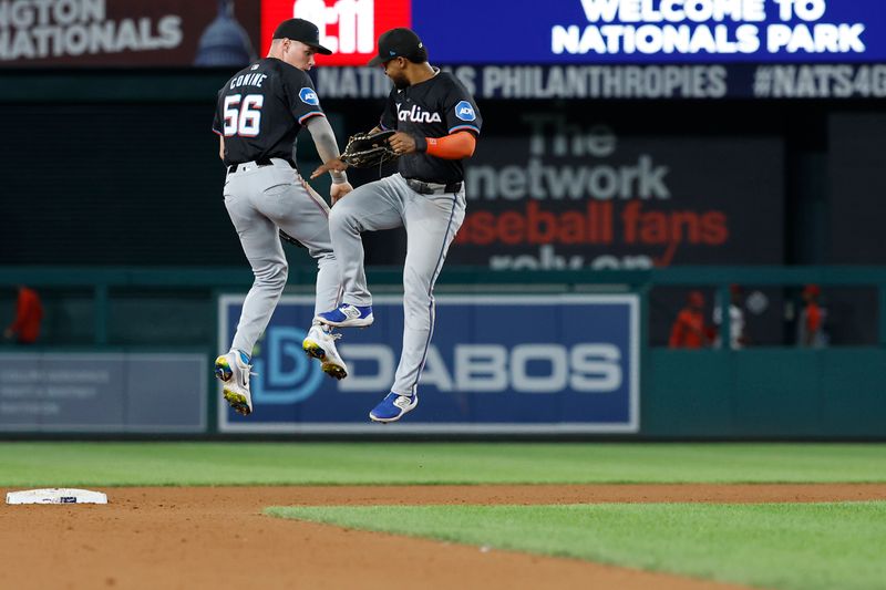 Sep 12, 2024; Washington, District of Columbia, USA; Miami Marlins outfielder Griffin Conine (56) and Marlins second baseman Otto Lopez (61) celebrate after their game against the Washington Nationals at Nationals Park. Mandatory Credit: Geoff Burke-Imagn Images