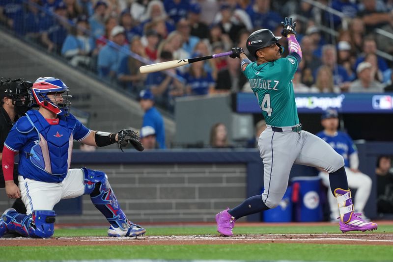 Oct 12, 2025; Toronto, Ontario, CAN; Seattle Mariners center fielder Julio Rodríguez (44) hits a single in the first inning against the Toronto Blue Jays during game one of the ALCS round for the 2025 MLB playoffs at Rogers Centre. Mandatory Credit: Nick Turchiaro-Imagn Images