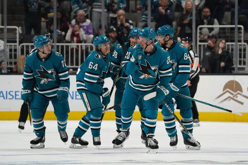 Apr 13, 2024; San Jose, California, USA; San Jose Sharks left wing William Eklund (72), San Jose Sharks center Mikael Granlund (64), San Jose Sharks defenseman Mario Ferraro (38), San Jose Sharks left wing Fabian Zetterlund (20), and San Jose Sharks defenseman Jan Rutta (84) celebrate after a goal during the fiirst period at SAP Center at San Jose. Mandatory Credit: David Gonzales-USA TODAY Sports