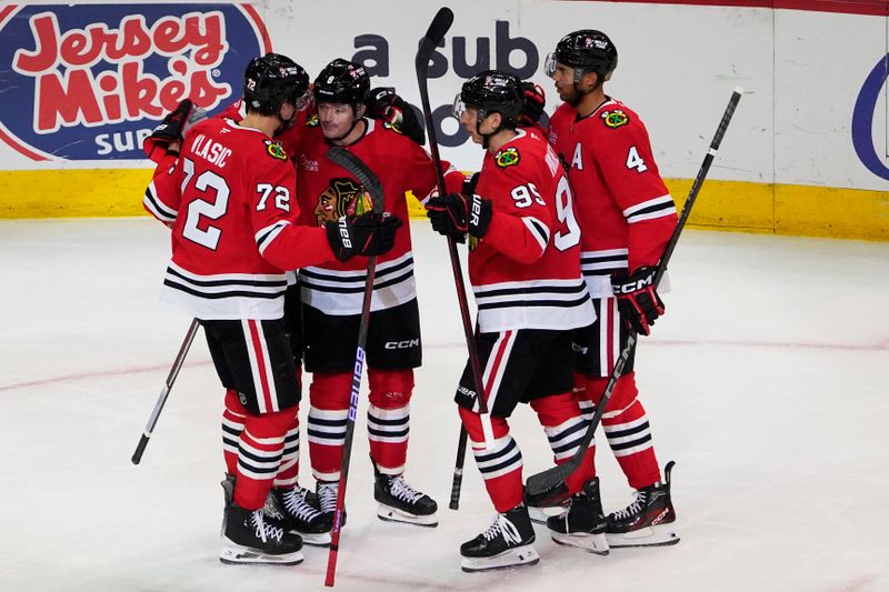 Oct 22, 2024; Chicago, Illinois, USA; Chicago Blackhawks center Ryan Donato (8) celebrates his goal against the Vancouver Canucks during the first period at United Center. Mandatory Credit: David Banks-Imagn Images