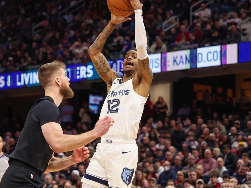 CLEVELAND, OH - FEBUARY 2:  Ja Morant #12 of the Memphis Grizzlies drives to the basket during the game on Febuary 2, 2023 at Rocket Mortgage FieldHouse in Cleveland, Ohio. NOTE TO USER: User expressly acknowledges and agrees that, by downloading and/or using this Photograph, user is consenting to the terms and conditions of the Getty Images License Agreement. Mandatory Copyright Notice: Copyright 2023 NBAE (Photo by  Lauren Bacho/NBAE via Getty Images)