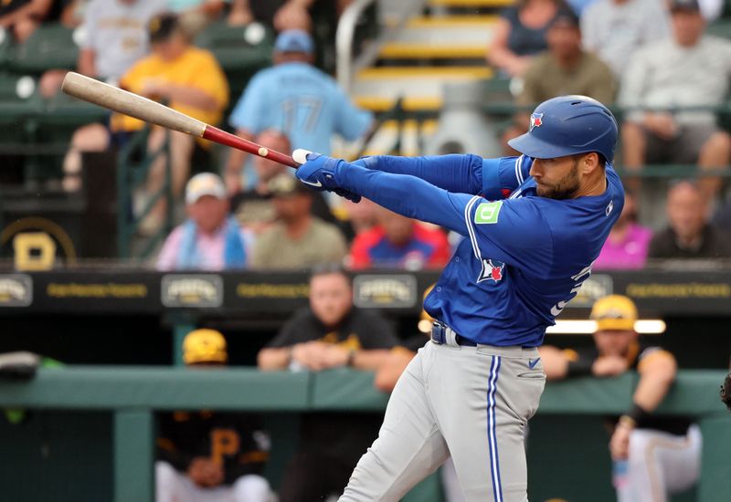 Mar 21, 2024; Bradenton, Florida, USA; Toronto Blue Jays center fielder Kevin Kiermaier (39) hits a run home run during the first inning against the Pittsburgh Pirates at LECOM Park. Mandatory Credit: Kim Klement Neitzel-USA TODAY Sports