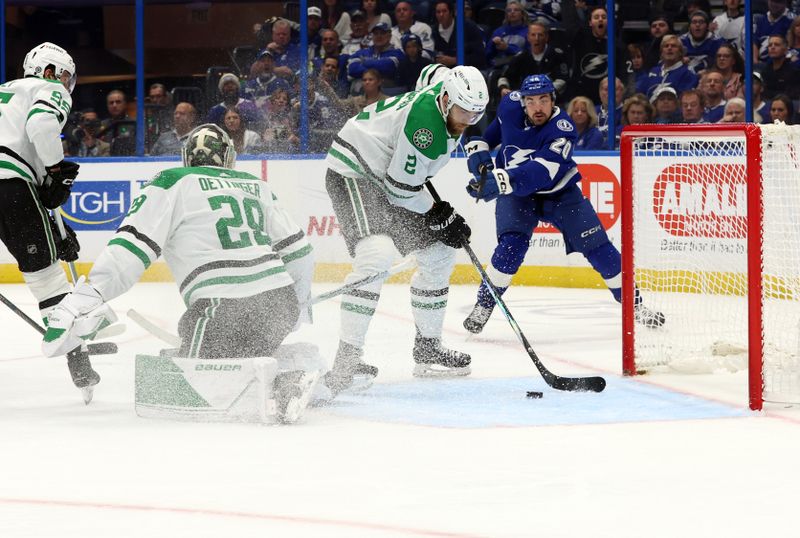 Dec 4, 2023; Tampa, Florida, USA; Dallas Stars defenseman Jani Hakanpaa (2) defends the puck against the Tampa Bay Lightning during the third period at Amalie Arena. Mandatory Credit: Kim Klement Neitzel-USA TODAY Sports