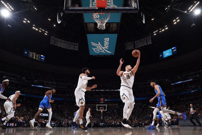 DENVER, CO - OCTOBER 24: Nikola Jokic #15 of the Denver Nuggets rebounds the ball during the game against the Oklahoma City Thunder on October 24, 2024 at Ball Arena in Denver, Colorado. NOTE TO USER: User expressly acknowledges and agrees that, by downloading and/or using this Photograph, user is consenting to the terms and conditions of the Getty Images License Agreement. Mandatory Copyright Notice: Copyright 2024 NBAE (Photo by Garrett Ellwood/NBAE via Getty Images)