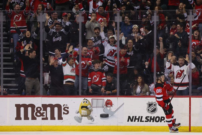 Nov 7, 2024; Newark, New Jersey, USA; New Jersey Devils center Jack Hughes (86) celebrates his goal against the Montreal Canadiens during the third period at Prudential Center. Mandatory Credit: Ed Mulholland-Imagn Images