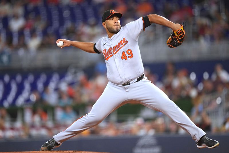 Jul 23, 2024; Miami, Florida, USA;  Baltimore Orioles starting pitcher Albert Suárez (49) pitches against the Miami Marlins in the first inning at loanDepot Park. Mandatory Credit: Jim Rassol-USA TODAY Sports