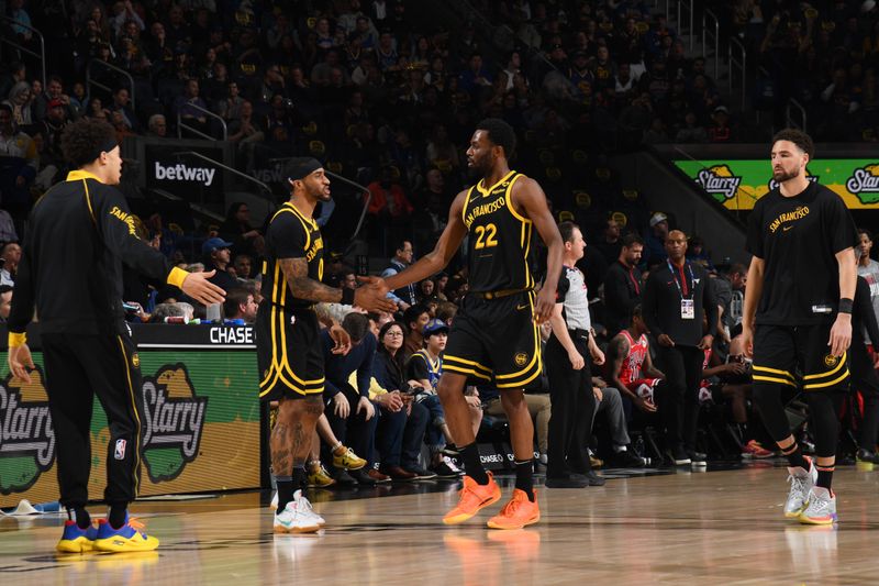 SAN FRANCISCO, CA - MARCH 7:  Gary Payton II #0 high fives  Andrew Wiggins #22 of the Golden State Warriors during the game against the Chicago Bulls on March 7, 2024 at Chase Center in San Francisco, California. NOTE TO USER: User expressly acknowledges and agrees that, by downloading and or using this photograph, user is consenting to the terms and conditions of Getty Images License Agreement. Mandatory Copyright Notice: Copyright 2024 NBAE (Photo by Noah Graham/NBAE via Getty Images)