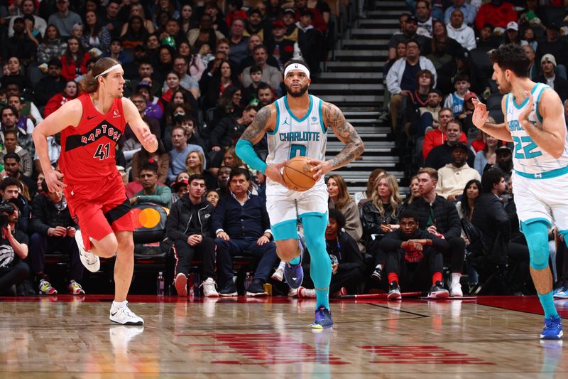 TORONTO, CANADA - MARCH 3: Miles Bridges #0 of the Charlotte Hornets looks to pass the ball during the game against the Toronto Raptors on March 3, 2024 at the Scotiabank Arena in Toronto, Ontario, Canada.  NOTE TO USER: User expressly acknowledges and agrees that, by downloading and or using this Photograph, user is consenting to the terms and conditions of the Getty Images License Agreement.  Mandatory Copyright Notice: Copyright 2024 NBAE (Photo by Vaughn Ridley/NBAE via Getty Images)