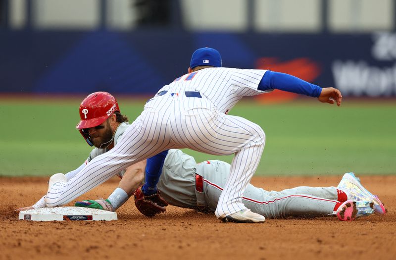 [US, Mexico & Canada customers only] June 8, 2024; London, UNITED KINGDOM;  Philadelphia Phillies player Bryce Harper slides into second base against New York Mets infielder Jose Iglesias during a London Series baseball game at Queen Elizabeth Olympic Park. Mandatory Credit: Matthew Childs/Reuters via USA TODAY Sports