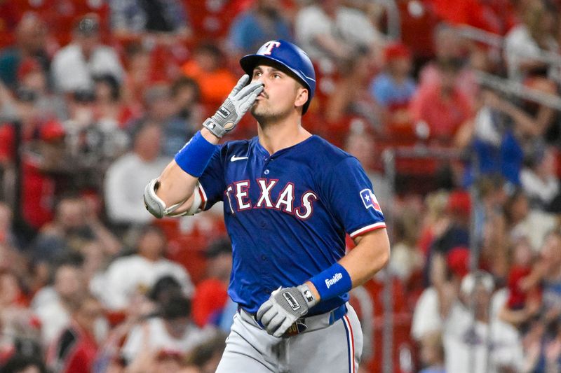Jul 29, 2024; St. Louis, Missouri, USA;  Texas Rangers first baseman Nathaniel Lowe (30) reacts after hitting a two run home run against the St. Louis Cardinals during the seventh inning at Busch Stadium. Mandatory Credit: Jeff Curry-USA TODAY Sports