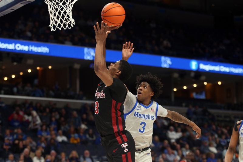 Feb 12, 2023; Memphis, Tennessee, USA; Temple Owls guard Hysier Miller (3) shoots as Memphis Tigers guard Kendric Davis (3) defends during the second half at FedExForum. Mandatory Credit: Petre Thomas-USA TODAY Sports