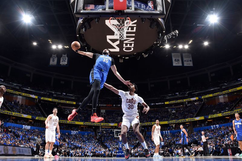 ORLANDO, FL - APRIL 25: Goga Bitadze #35 of the Orlando Magic goes to the basket during the game against the Cleveland Cavaliers during Round 1 Game 3 of the 2024 NBA Playoffs on April 25, 2024 at Kia Center in Orlando, Florida. NOTE TO USER: User expressly acknowledges and agrees that, by downloading and or using this photograph, User is consenting to the terms and conditions of the Getty Images License Agreement. Mandatory Copyright Notice: Copyright 2023 NBAE (Photo by Fernando Medina/NBAE via Getty Images)