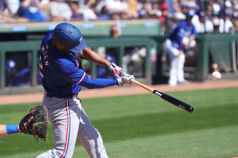 Mar 9, 2024; Phoenix, Arizona, USA; Texas Rangers second baseman Marcus Semien (2) bats against the Los Angeles Dodgers during the third inning at Camelback Ranch-Glendale. Mandatory Credit: Joe Camporeale-USA TODAY Sports