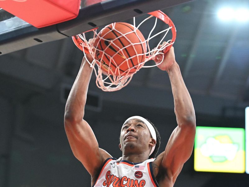 Dec 21, 2023; Syracuse, New York, USA; Syracuse Orange forward Maliq Brown (1) dunks the ball in the second half against the Niagara Purple Eagles at the JMA Wireless Dome. Mandatory Credit: Mark Konezny-USA TODAY Sports