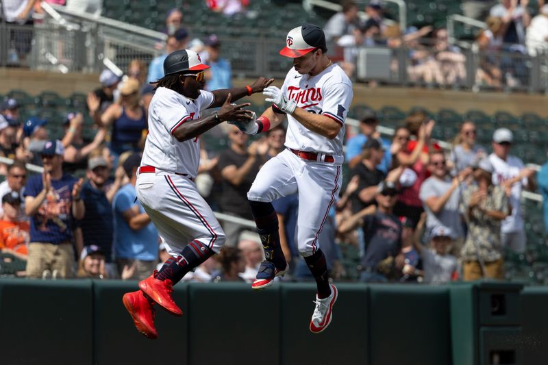 Aug 16, 2023; Minneapolis, Minnesota, USA; Minnesota Twins right fielder Max Kepler (26) jumps up and celebrates with third base coach Tommy Watkins (40) after hitting a solo home run in the ninth inning against the Detroit Tigers at Target Field. Mandatory Credit: Jesse Johnson-USA TODAY Sports