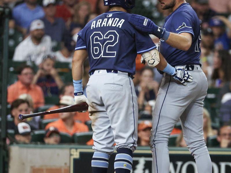 May 29, 2025; Houston, Texas, USA; Tampa Bay Rays right fielder Josh Lowe (15) talks to first baseman Jonathan Aranda (62) before Aranda’s bat against the Houston Astros  in the seventh inning at Daikin Park. Mandatory Credit: Thomas Shea-Imagn Images