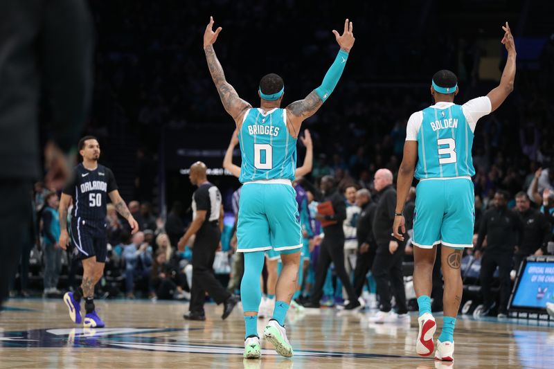 CHARLOTTE, NC - APRIL 5:  Miles Bridges #0  and Marques Bolden #3 of the Charlotte Hornets react during the game against the Orlando Magic on April 5, 2024 at Spectrum Center in Charlotte, North Carolina. NOTE TO USER: User expressly acknowledges and agrees that, by downloading and or using this photograph, User is consenting to the terms and conditions of the Getty Images License Agreement.  Mandatory Copyright Notice:  Copyright 2024 NBAE (Photo by Brock Williams-Smith/NBAE via Getty Images)