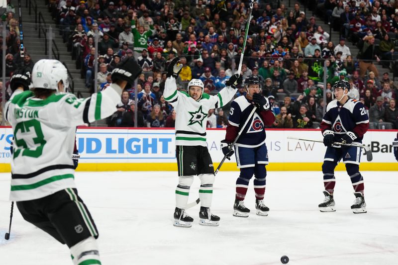 Feb 27, 2024; Denver, Colorado, USA; Dallas Stars center Logan Stankoven (11) celebrates his goal in the first period  against the Colorado Avalanche in the first period at Ball Arena. Mandatory Credit: Ron Chenoy-USA TODAY Sports